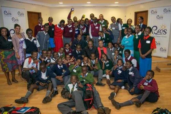 President Uhuru Kenyatta and First Lady Margaret takes pictures with students under the Pupils Reward Scheme mentorship programme, who were hosted at State House, Nairobi, on Thursday night.