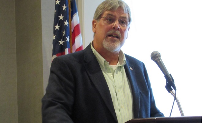 Captain Richard Phillips speaks to the Montpelier Rotary Club from a podium in the Governor’s Ballroom at the Capitol Plaza Hotel September 21.