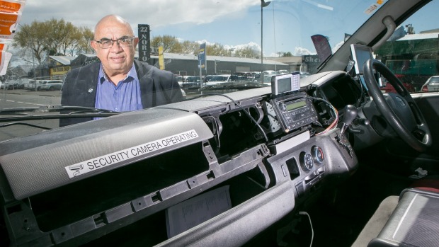 Hamilton Taxis general manager Andy Collins with a taxi driver's van robbed at knifepoint by youths.