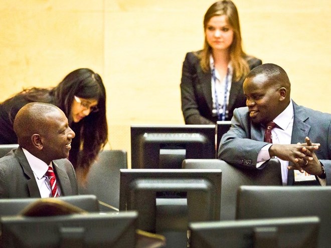 Deputy President William Ruto and journalist Joshua Sang chat at the ICC. Photo/FILE