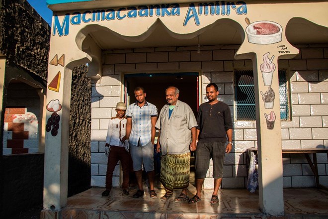 Yemeni business owners stand in front of their shop in Hargeisa. Yemeni migrants have been traveling to Somaliland for work opportunities well before the conflict in Yemen.