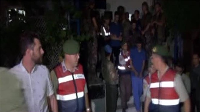 Turkish special forces capture 11 soldiers suspected of planning to seize President Erdogan during coup attempt.