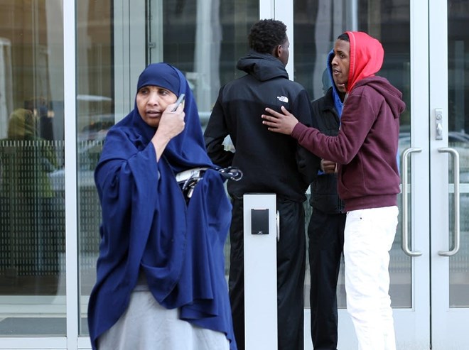 Friends consoled each other after the hearing in St. Paul in April, 2015, when a judge found probable cause to hold Adnan Farah, Zacharia Abdurahman, Hanad Musse and Guled Omar on conspiracy charges. Laura Yuen | MPR News 2015