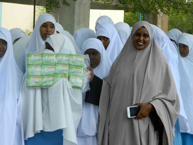 Garissa county women representative aspirant Fatuma Kinsi with students of Umu-Salama girls secondary school in Garissa in september this year.she has vowed to have her name on the ballot.Photo Stephen Astariko