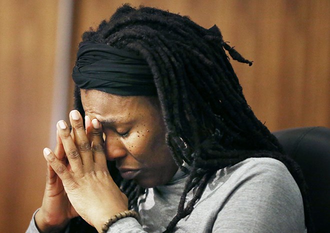 An emotional Minneapolis school board member Tracine Asberry cried in the midst of a motion to select interim superintendent Michael Goar as the board's preferred candidate, protestors shut down the school board meeting. Tuesday January 12, 2016 in Minneapolis, MN.