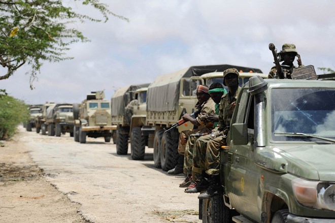 Troops of the Somali National Army and the African Union Mission in Somalia, line up in a convoy on the road leading up to the Al-Shabaab stronghold of Barawe. Photo: AMISOM/Tobin Jones