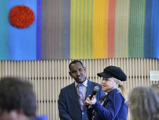Chris Harbron, a St. Cloud lawyer, speaks about separating law, culture and the religion of Islam as she relates a story about her sister's experience marrying an Iranian muslim Saturday, Jan 2. The question and comments came during a Somali American political and progress panel discussion at St. Cloud Public Library.
(Photo: Kimm Anderson)