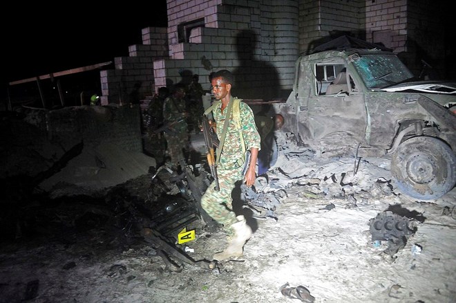 Somali security officers inspect the scene of a car bomb attack in Mogadishu last week. Photo: Mohammed Abdiwahab/Scanpix