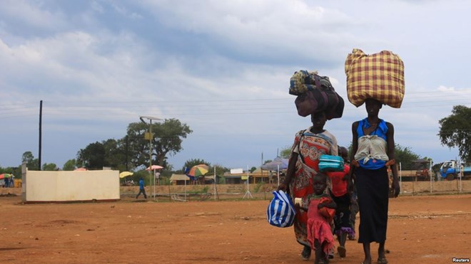 South Sudan refugees family arrives at the U.N. High Commissioner for Refugees-managed refugee reception point at Elegu, in Amuru district of the northern region near the South Sudan-Uganda border, August 20, 2016.