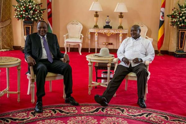 President Uhuru Kenyatta is received by his Ugandan counterpart and host Yoweri Museveni at State House, Entebbe when arrived in the country to attend a diplomats event. PHOTO | PSCU