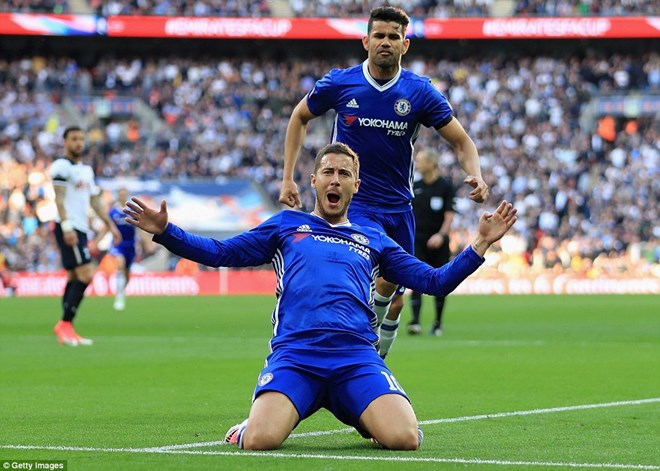 The Belgian celebrates in front of the Chelsea fans after coming off the bench and inspiring his side into the FA Cup final