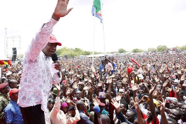 President Uhuru Kenyatta waves to residents of Wajir town during a rally on April 9, 2017. He urged them to vote for him in this year's polls. PHOTO | CHARLES KIMANI | DPPS
