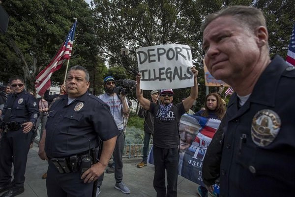 Trump supporters confronts marchers during the Immigrants Make America Great March to protest actions being taken by the Trump administration on February 18, 2017 in Los Angeles, California. PHOTO | DAVID MCNEW | AFP