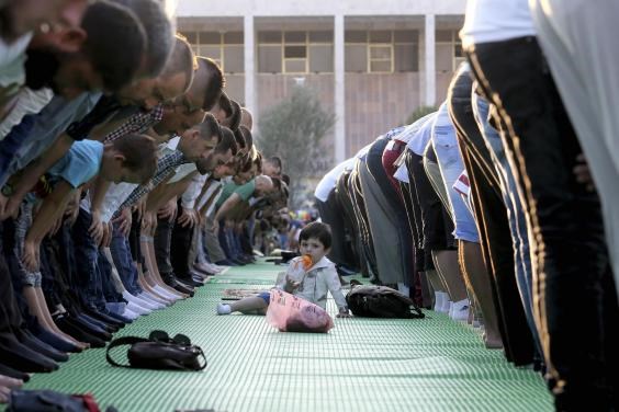 In Albanian capital Tirana, prayers take place on recently renovated Skanderbeg Square (AP / Hektor Pustina)