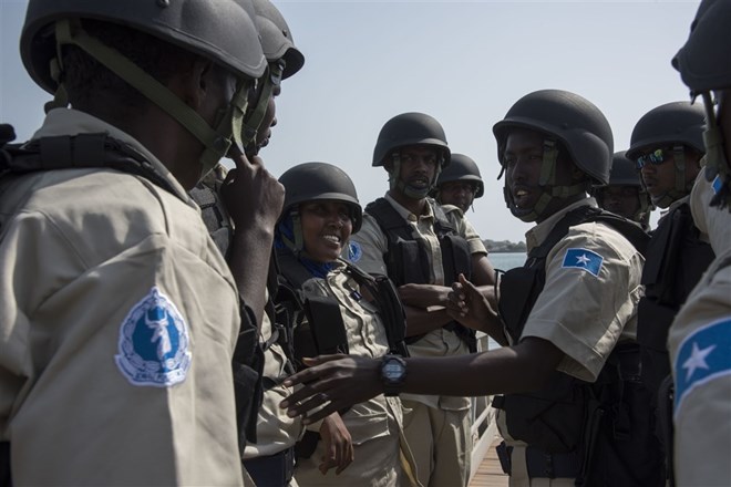 Participants from the Djibouti coast guard and Somali maritime police pose for a photo together during exercise Cutlass Express 2018 in the Port of Djibouti Feb. 5, 2018.(U.S. Air National Guard photo by Staff Sgt. Allyson Manners)