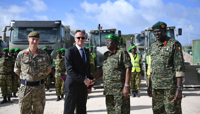 David Concar, the UK Ambassador to Somalia hands over vehicles donated by the UK Government to Lt. Gen. Jim Beesigye Owoyesigire, the African Union Mission in Somalia (AMISOM) Force Commander during a ceremony held in Mogadishu on June 30, 2018. AMISOM Photo / Ilyas Ahmed