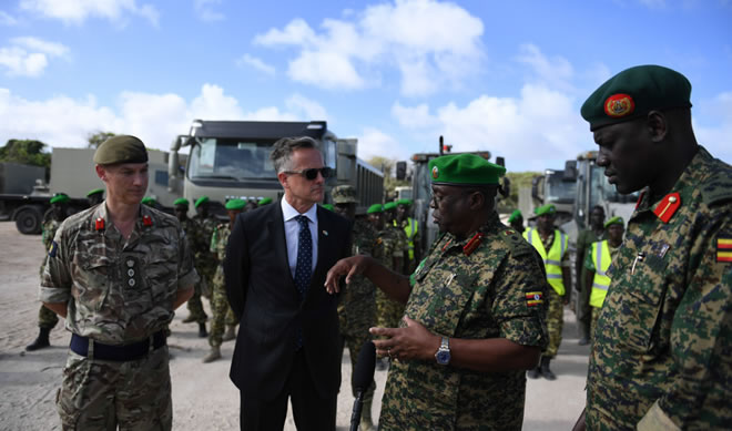 David Concar, the UK Ambassador to Somalia hands over vehicles donated by the UK Government to Lt. Gen. Jim Beesigye Owoyesigire, the African Union Mission in Somalia (AMISOM) Force Commander during a ceremony held in Mogadishu on June 30, 2018. AMISOM Photo / Ilyas Ahmed