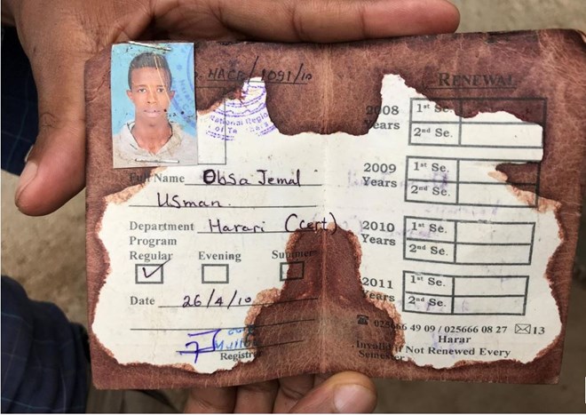 World News
July 23, 2018 / 4:11 PM / Updated 15 hours ago
Far from Ethiopia's capital, change remains a distant dream
Maggie Fick

5 Min Read

HARAR, Ethiopia (Reuters) - Clutching the bloodstained student ID card and post-mortem certificate of his younger brother, Abedir Jamal’s elation at the huge changes underway in Ethiopia is tempered by his fear that they won’t reach him.
Abedir Jamal holds the identification card of his late brother Obsa Jemal, who was killed in anti-government protests, during a Reuters interview in Harar, Ethiopia July 22, 2018. REUTERS/Maggie Fick