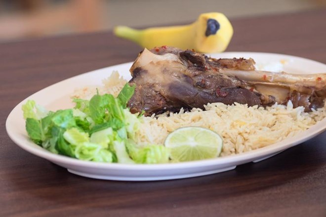 A lamb on rice dish with salad and a banana made at Brothers Restaurant and Grocery. Photo by Jackson Forderer