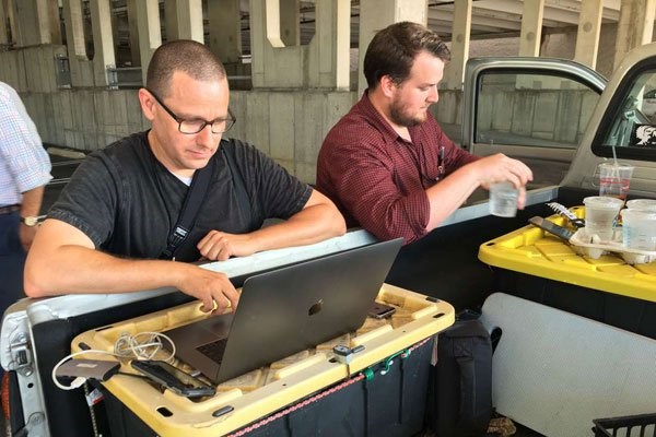 Capital Gazette reporter Chase Cook (right) and photographer Joshua McKerrow work on the next day’s newspaper while awaiting news from their colleagues in Annapolis, Maryland, June 28, 2018. PHOTO | IVAN COURONNE | AFP