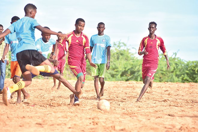 Locals enjoy a football match