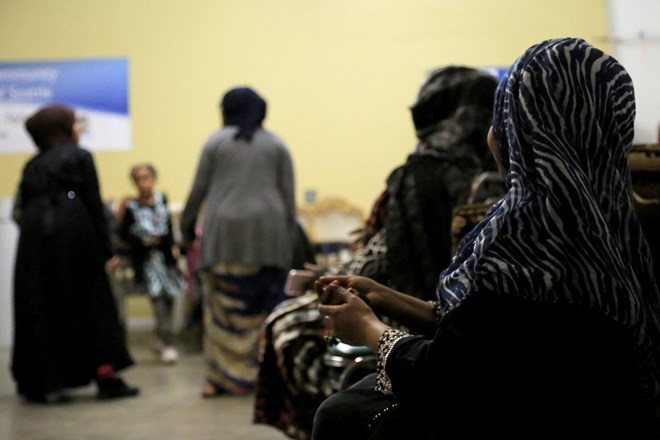 Esther (far right) watches her children and smiles often during the practice. “Cause I’m a mom,” Esther said. “Raising kids, it’s very hard. Everybody knows.” When Esther first came to the United States nearly 20 years ago, she said things were new and challenging. Esther compared that experience to having her first child. (Photo by Ester Ouli Kim.)