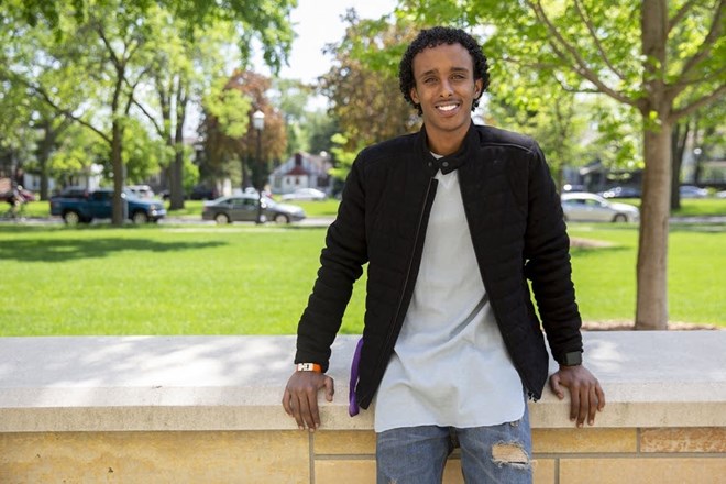 Amin Abdulkadir stands for a portrait wearing his Embracelet on the University of St. Thomas campus on Wednesday. Evan Frost | MPR News