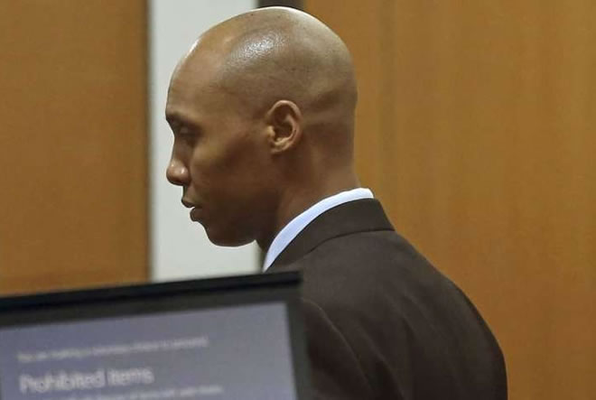 CORRECTS TO APRIL 25, 2019-Mohamed Noor, the former Minneapolis police officer waits to go through security at the Hennepin County Government Center Thursday, April 25, 2019 in Minneapolis in the fourth week of his trial.