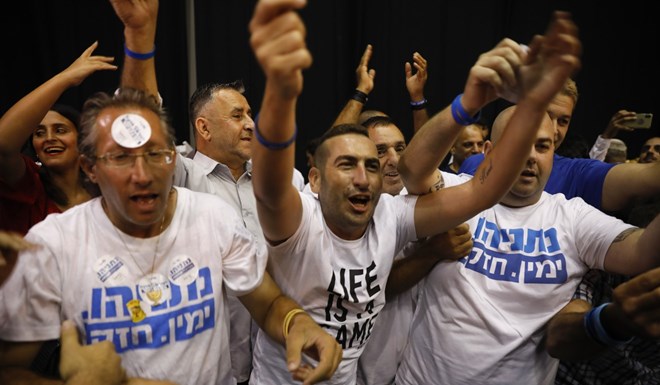 Supporters of Israeli Prime Minister Benjamin Netanyahu chant as they await results of the elections in Tel Aviv on Tuesday. Photo: AP
