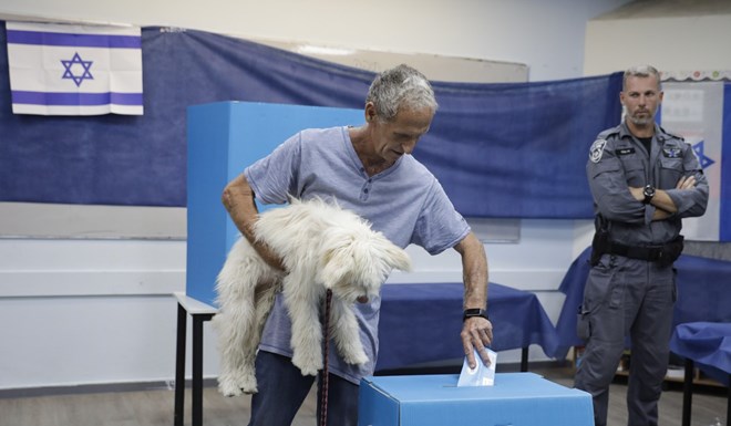 A man votes at a polling station in Rosh Haayin, Israel, on Tuesday. Photo: AP